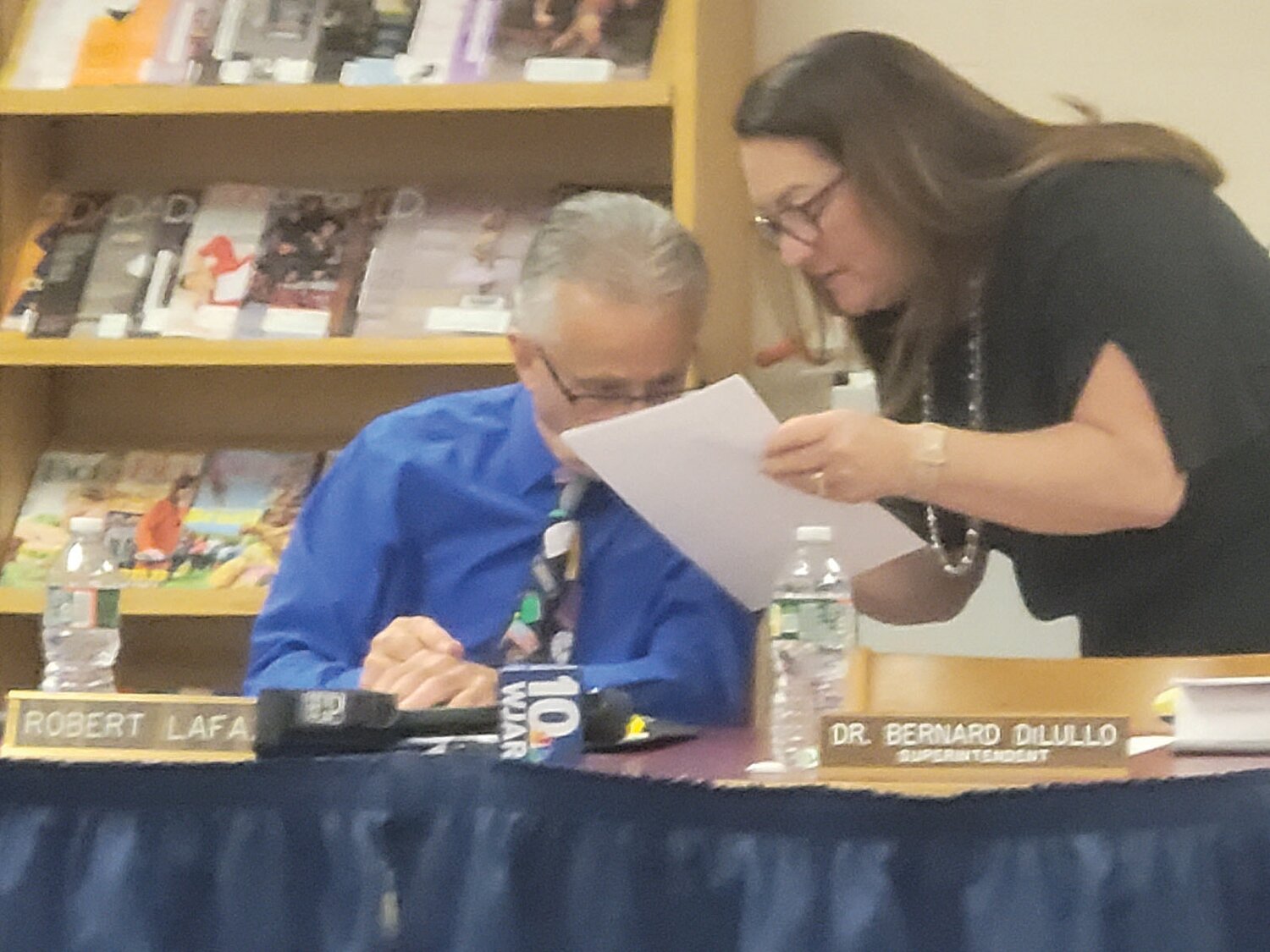 TAKING A STAND: School Committee Chairman Robert LaFazia and member Susan Mansolillo confer during one of last week’s charged meetings.